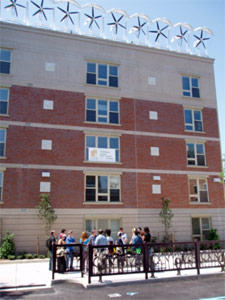 Left: Wind turbines mounted on an apartment building in the Bronx, New 