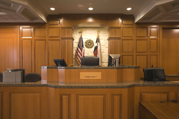 This judge's bench is raised for optimal viewing across the courtroom and to create the sightlines and hierarchy necessary for the courtroom's proceedings