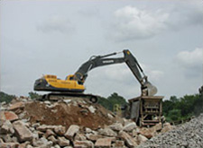 Construction digger at a concrete recycling yard