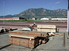 Stacks of salvaged lumber at the jobsite