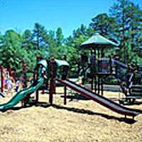 Playground equipment installed in the Gross Motor Zone with sides, climbing ladders, and cross bar equipment