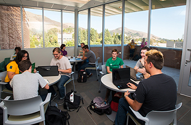 Interior open space with students studying and gathering in the Warren J. Baker Center for Science and Mathematics at Cal Poly, San Luis Obispo, CA