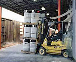 Photo of a warehouse worker using the forklift