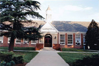 Entrance of community center in Arilinton, VA, front view of long sidewalk up th front door
