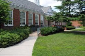 Area in front of community center in Arlington, VA with landscaped access ramps