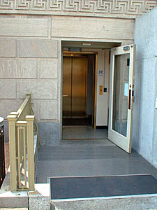Photo of a lower entrace door giving access to a new elevator in the Dept of Agriculture South Building