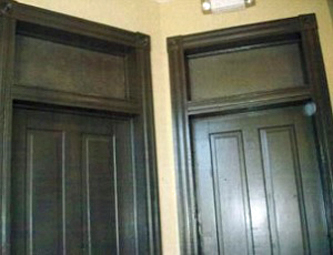 Two door interior doors with drywall behind the transoms