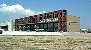 Photo of aircraft maintenance hangar with header truss roof framing system