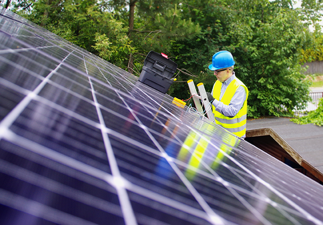 installing solar panels on the roof of a new project