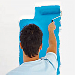 stock photo of a man using a paint roller