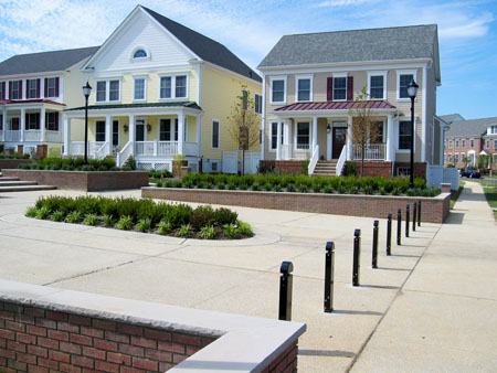 residential neighborhood with bollards lining the entry to a central courtyard