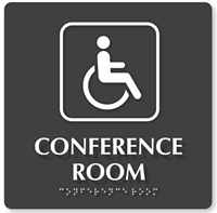 handicap signage for a conference room featuring the wheelchair symbol and braille
