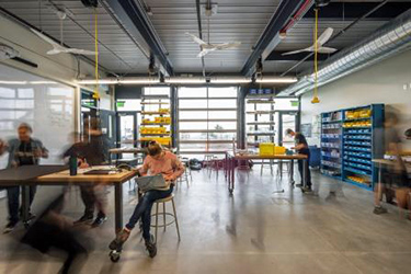 Student space at Sonoma Academy's Janet Durgin Guild and Commons with automatic exterior shades on the south and movable wooden screens to the north and west