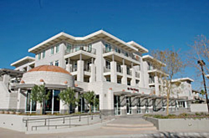 Photo of building with EIFS stucco and stone appearance