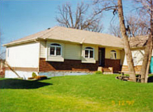 Photo of house lifted out of the ground by buoyant forces during a flood