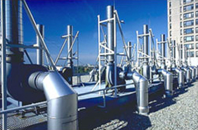 Photo of HVAC equipment mounted on a building's rooftop