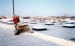 application of aggregate ballast over a single-ply membrane