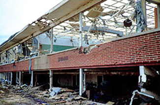Extensive damage to an office building's curtain wall and interior during the F1/F2 Fort Worth Tornado