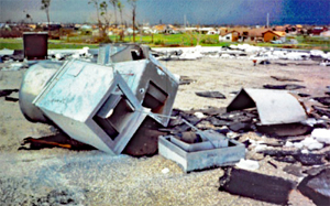 Rooftop mechanical equipment that has blown over leaving a hole through which rain water enters the building