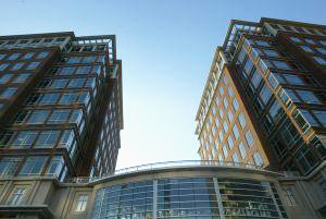 view looking up between two tall buildings