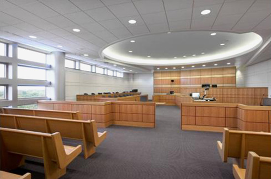 main aisle in a courtroom of adequate width that also includes a rail without a gate for ease of access