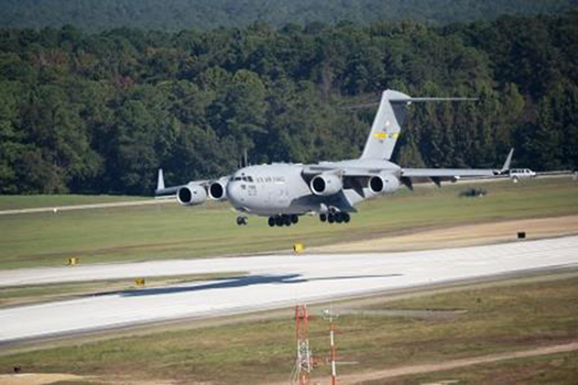 C-17 touching down on runway, Pope Army Airfield