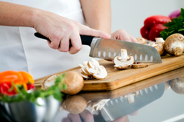 hand-prepping vegetables