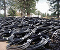 Photo showing numerous piles of polyethylene piping