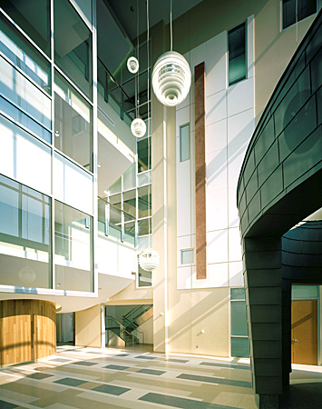 This fire stair, which doubles as an architectural stair, has a fire shutter on the first floor; glazing is on the remaining floors.