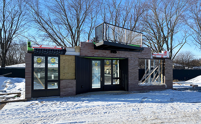 mockup building with 3M air barrier and Pella windows installed