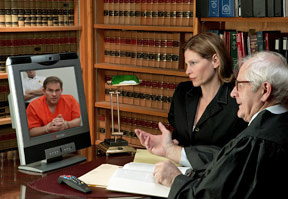 Lawyer and judge speaking to defendant via the Internet