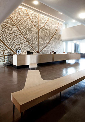 lobby featuring large-scale artwork, high-end materials and finishes, taking advantage of the large volume of the space