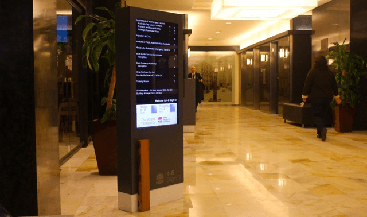government building lobby featuring digital signage