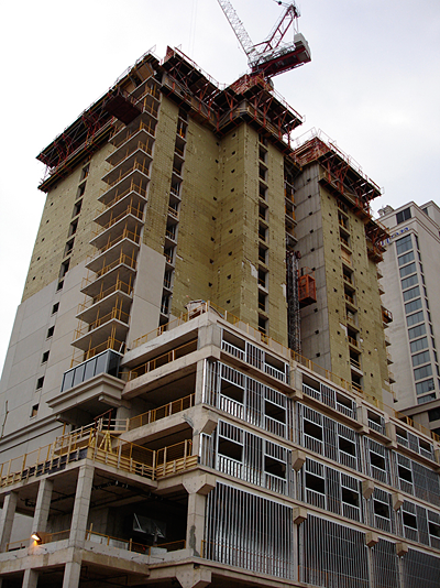 Figure 8: Continuous insulation placed over a reinforced concrete structure is an effective means of achieving a highly durable and energy efficient building enclosure. To achieve the same effective thermal resistance in the wall areas with steel studs, more insulation and careful detailing will be required.