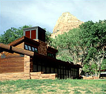 Photo of visitor center at Zion National Park showing downdraft cooling tower with evaporative media at the top, and exhaust through high clerestory windows
