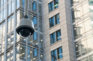 CCTV surveillance security dome on the exterior of a corporate office building