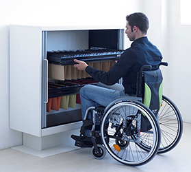 man in wheelchair with universal office storage - filing cabinet