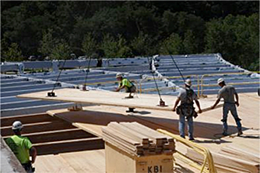 cross-laminated timber roof panel being installed