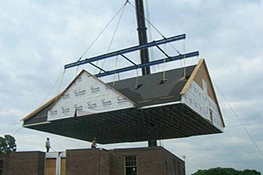 roof assembly being delivered and installed on-site