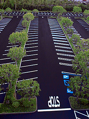 Aeriel view of large parking lot interspersed with trees