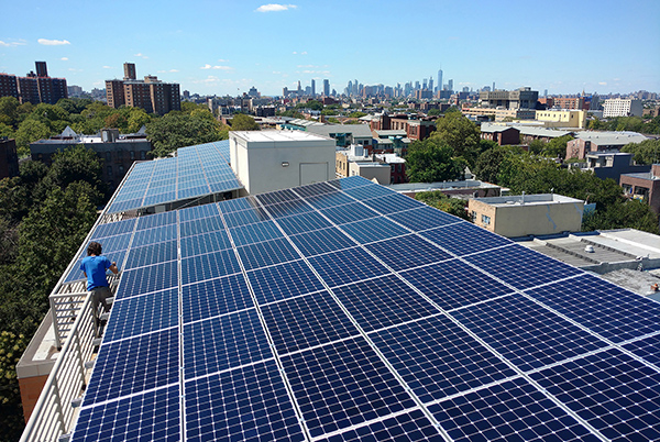 PV crystalline silicon modules being installed on a roof-top in New York City