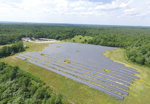 Aerial photo of utility-scale installation located over a retired landfill in Massachusetts