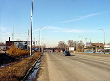 Urban area with a depressing layout mixing retail and residential along the corridor