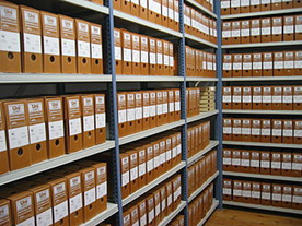 Shelved record boxes of an archive.