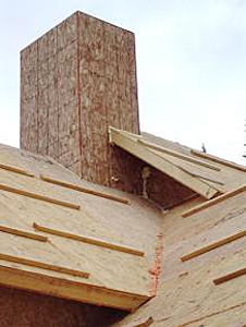 Exterior view of roof construction with SIPs roof panels showing seeping of sealant at SIP joint