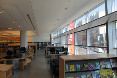 Curtain wall and a light shelf in a second-floor library space