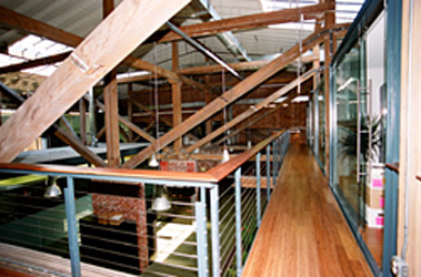 Interior view of trusses and catwalk on conversion of a former manufacturing building