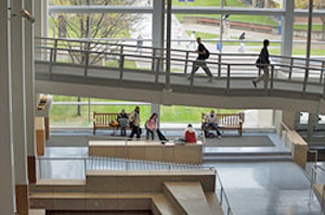 Winona State University interior stairs and halls constructed in dynamic circulation patterns with a 2 story wall of windows