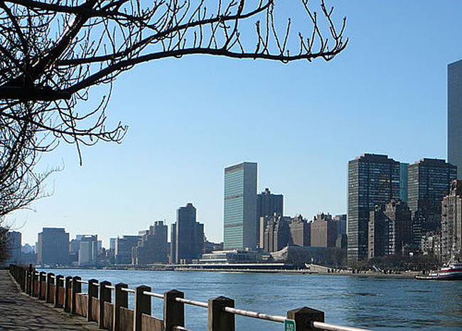 View of the United Nations Headquarters in the background across the East River.