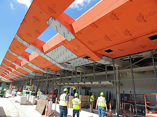 WrapShield SA (in orange) being installed at Cleveland Hopkins Airport
